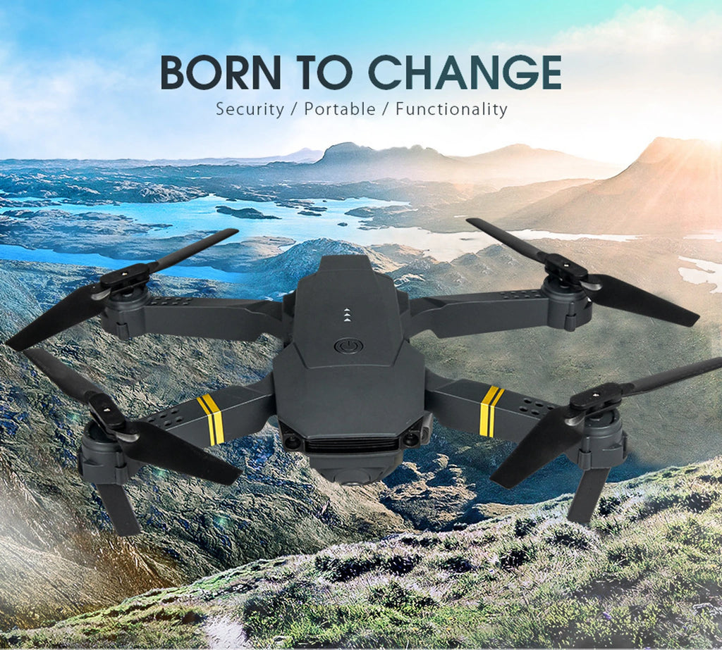 Drone flying over a mountainous landscape with text 'Born to Change' on a blue sky background.