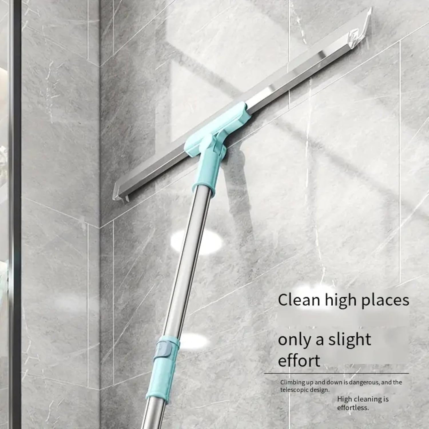 Cleaning tool with a long handle and squeegee attachment cleaning a glass surface.