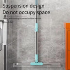 Mop with suspension design against a tiled wall background
