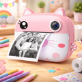 Pink cartoon-style photo printer on a wooden table with a family photo printed on paper.
