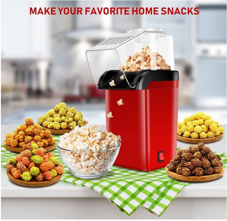Red popcorn maker with various types of snacks on a kitchen counter